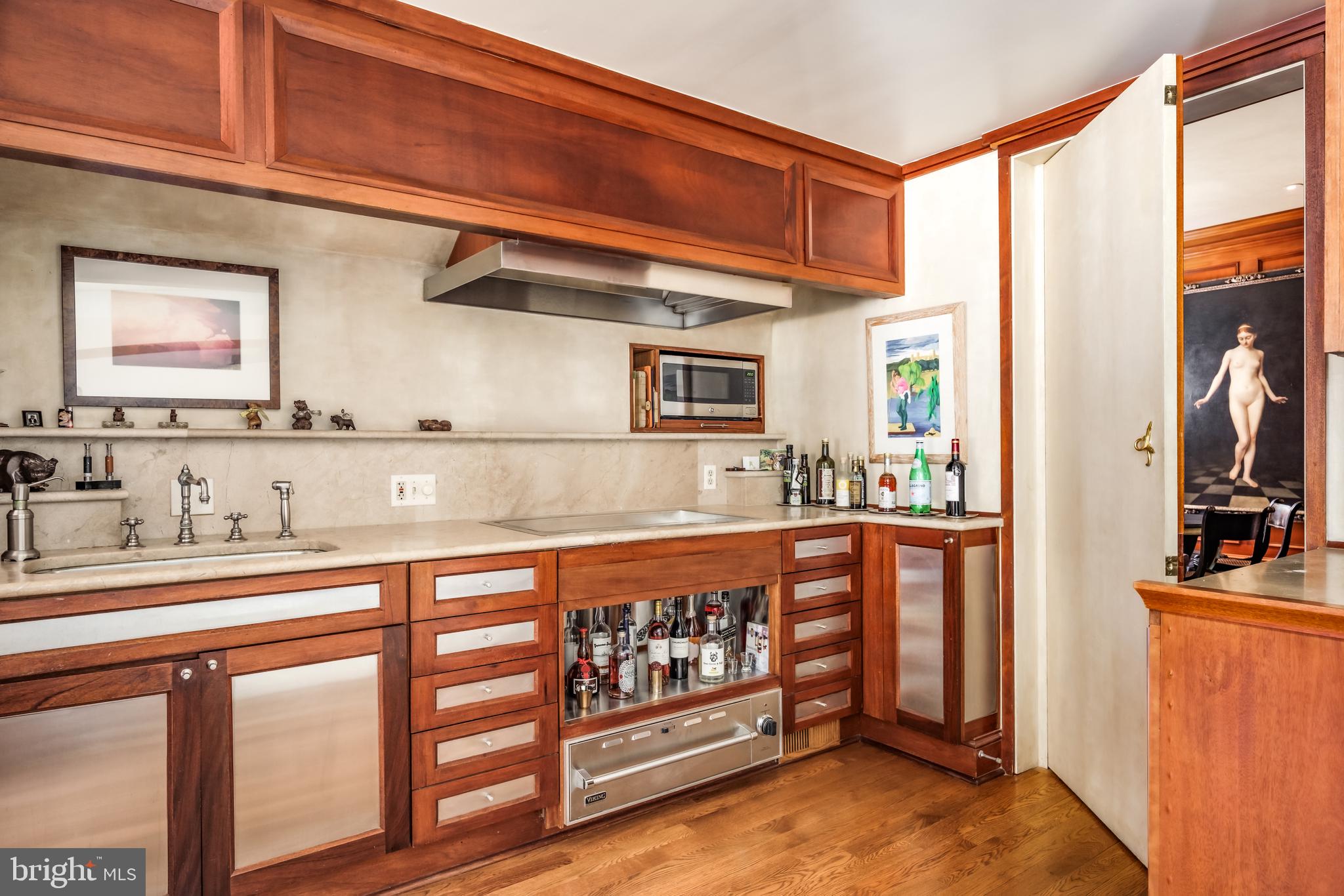 2740 Chain Bridge Road Northwest Washington, DC 20016 - Photo 14 of 50 a kitchen with stainless steel appliances granite countertop a refrigerator and a sink