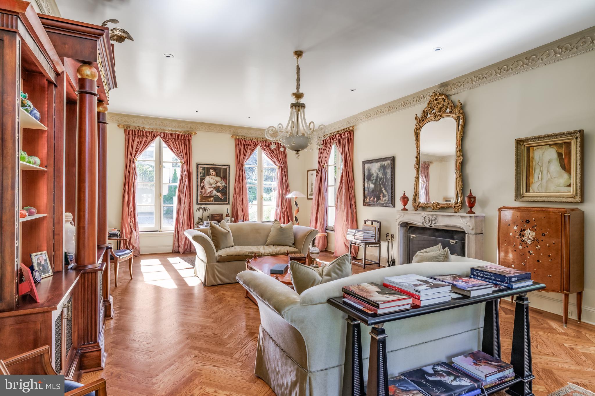 2740 Chain Bridge Road Northwest Washington, DC 20016 - Photo 17 of 50 a living room with furniture a fireplace and a chandelier