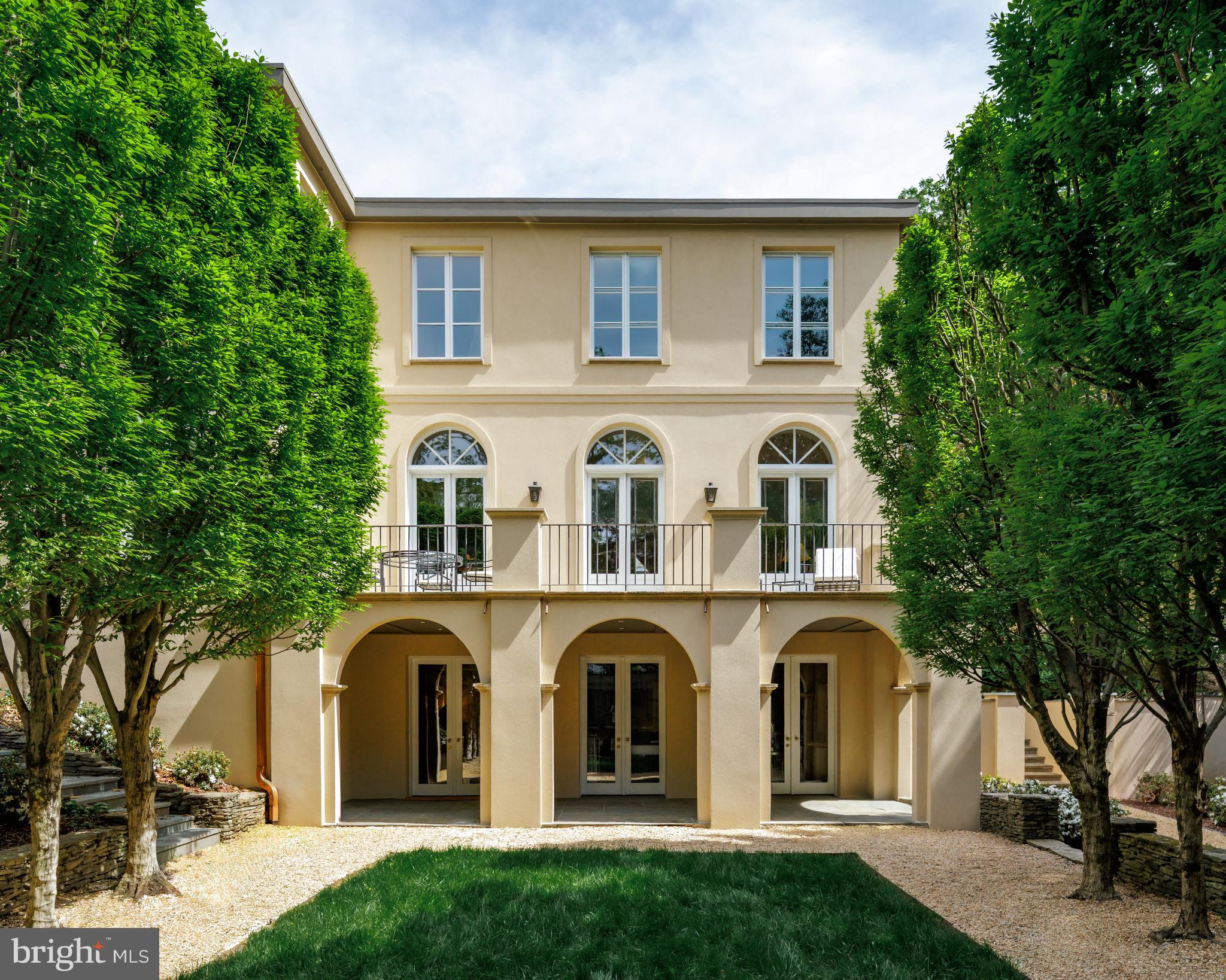 2740 Chain Bridge Road Northwest Washington, DC 20016 - Photo 21 of 50 a front view of a house with a garden