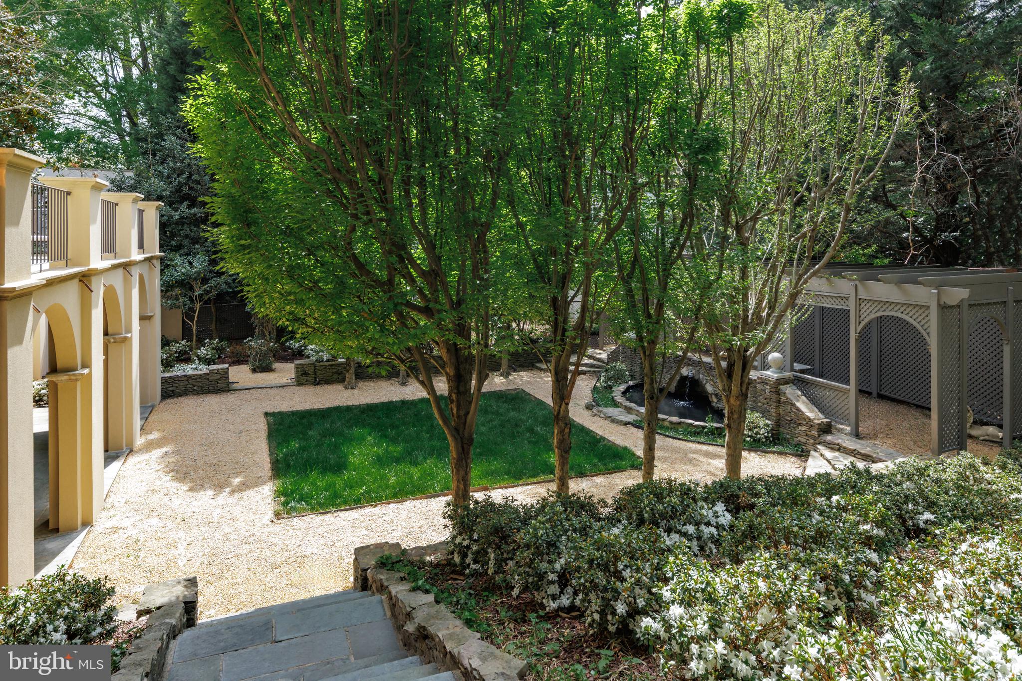 2740 Chain Bridge Road Northwest Washington, DC 20016 - Photo 24 of 50 a view of a chair and table in the garden
