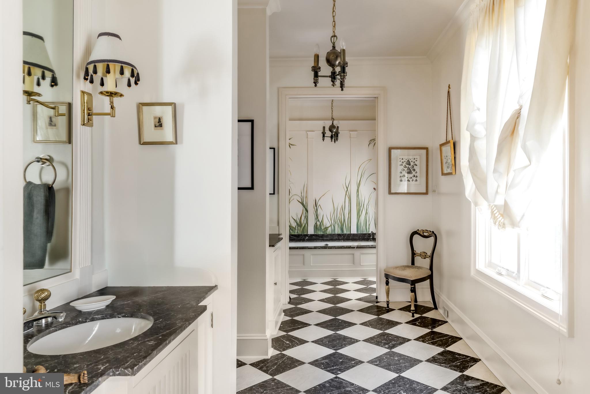 2740 Chain Bridge Road Northwest Washington, DC 20016 - Photo 29 of 50 a bathroom with a sink a mirror and a shower