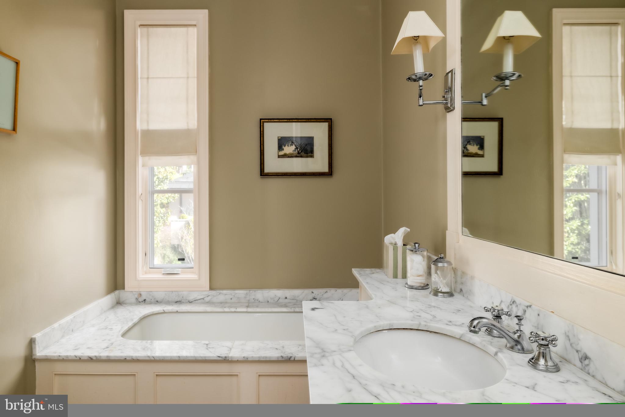 2740 Chain Bridge Road Northwest Washington, DC 20016 - Photo 32 of 50 a bathroom with a granite countertop sink and a mirror