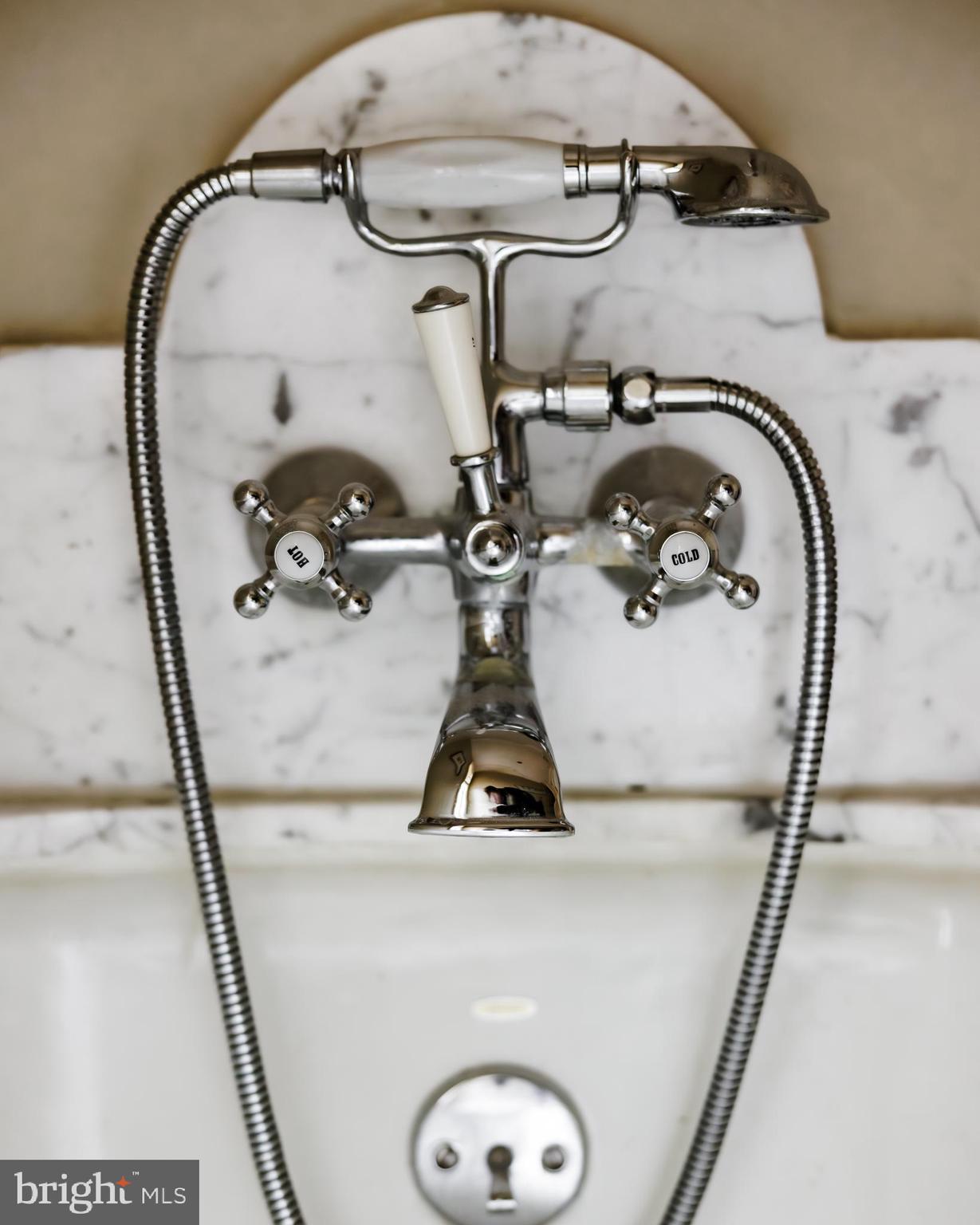 2740 Chain Bridge Road Northwest Washington, DC 20016 - Photo 33 of 50 a bathroom with a sink and mirror