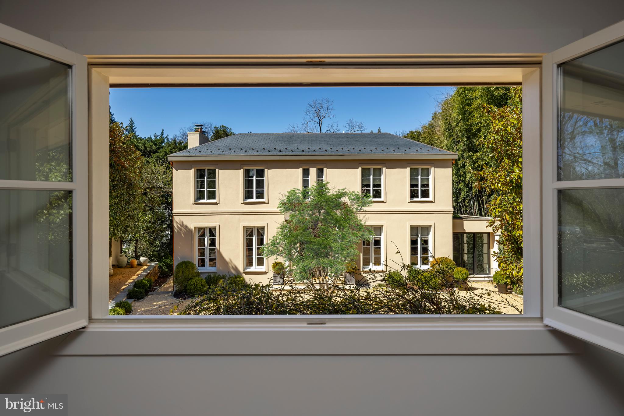 2740 Chain Bridge Road Northwest Washington, DC 20016 - Photo 4 of 50 a front view of a house with a yard