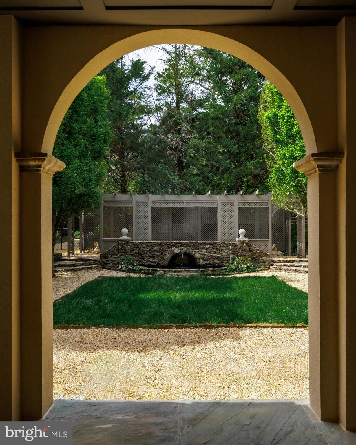 2740 Chain Bridge Road Northwest Washington, DC 20016 - Photo 48 of 50 a front view of a house with garden