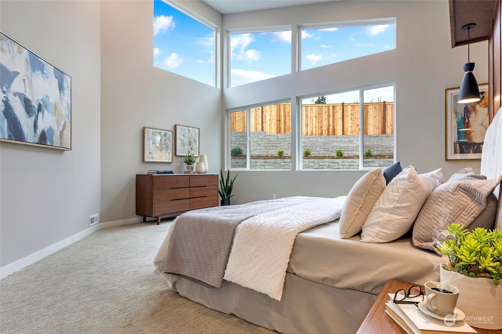 10053 Northeast 196th Place Bothell, WA 98011 - Photo 18 of 40 a bedroom with a bed and a couch