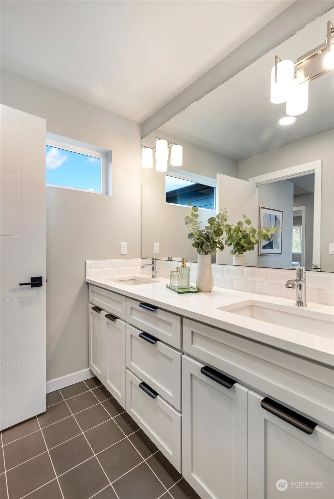 10053 Northeast 196th Place Bothell, WA 98011 - Photo 30 of 40 a spacious bathroom with a double vanity sink mirror and