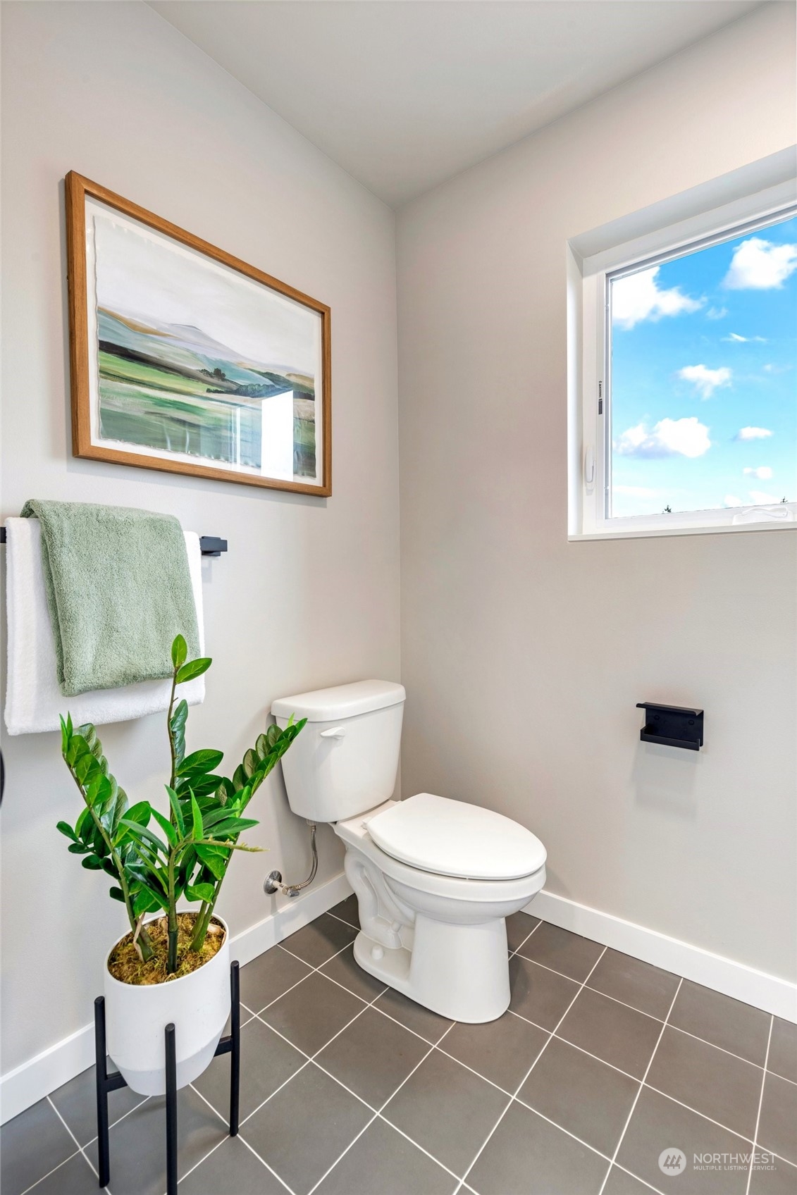 10053 Northeast 196th Place Bothell, WA 98011 - Photo 31 of 40 a bathroom with a toilet a sink and a window