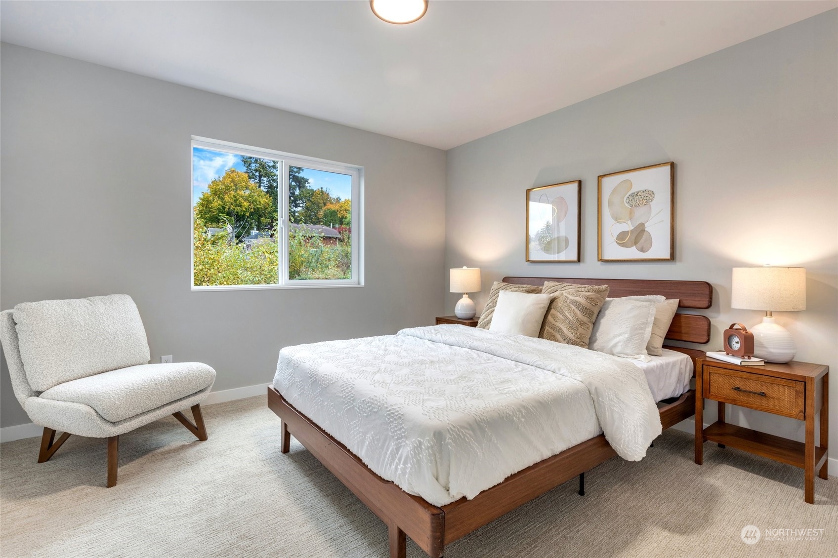 10053 Northeast 196th Place Bothell, WA 98011 - Photo 32 of 40 a bedroom with a bed and a chair