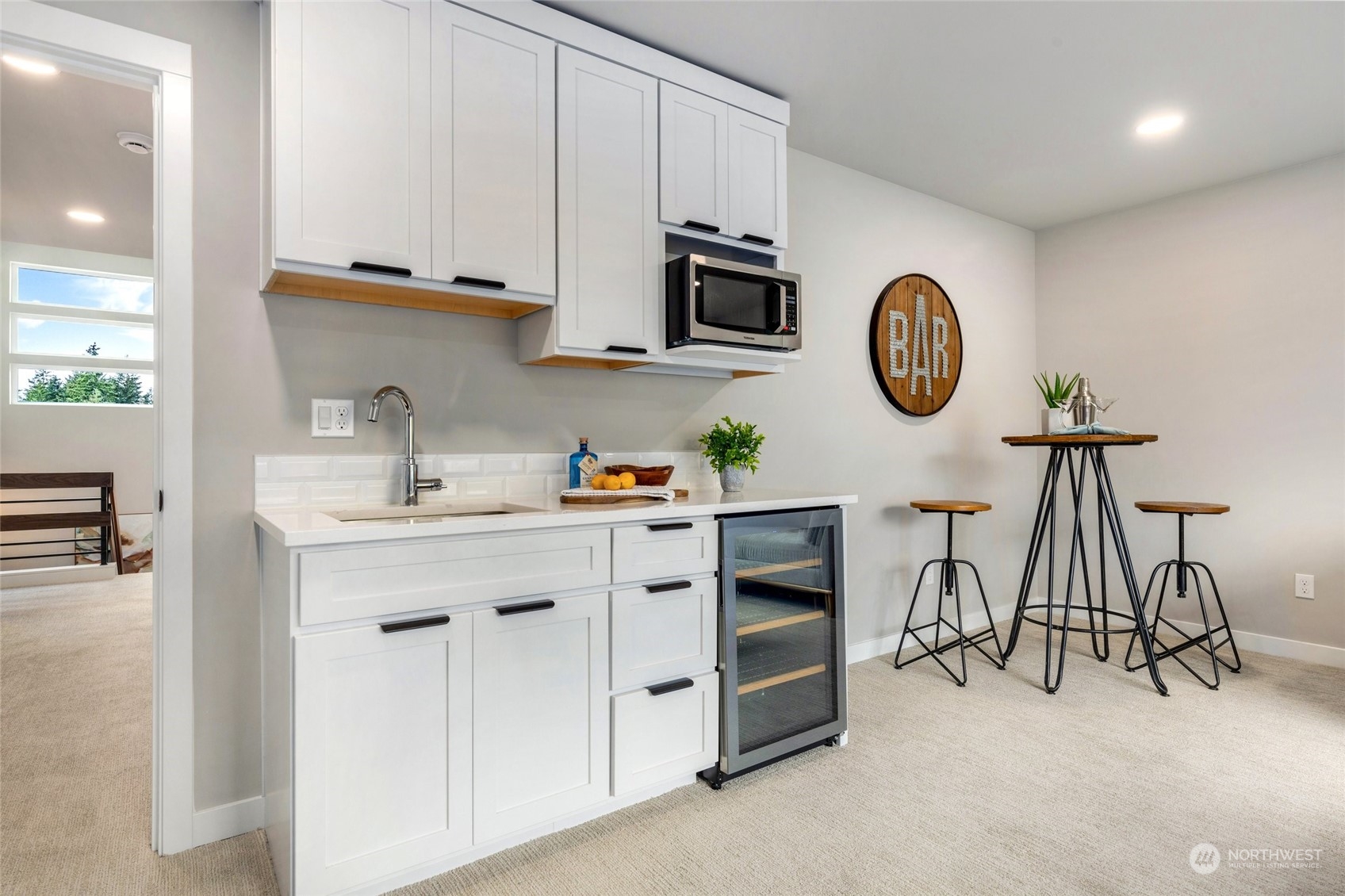 10053 Northeast 196th Place Bothell, WA 98011 - Photo 35 of 40 a kitchen with stainless steel appliances a white cabinet and a stove top oven