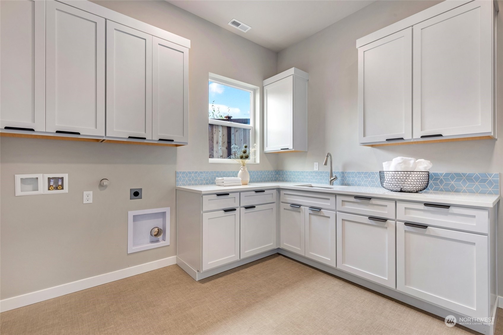 10053 Northeast 196th Place Bothell, WA 98011 - Photo 36 of 40 a kitchen with granite countertop white cabinets and white appliances