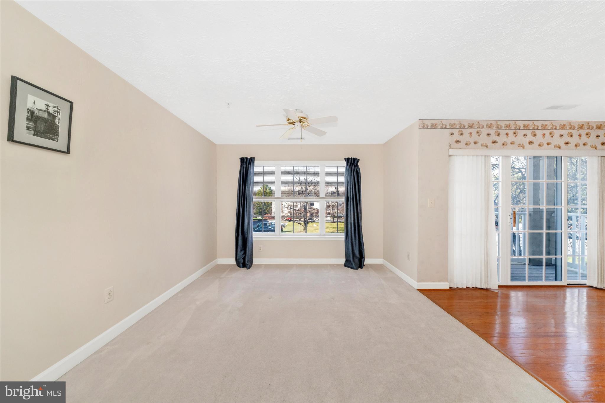 6117 Springwater Place, Unit 1723 Frederick, MD 21701 - Photo 13 of 50 a view of an empty room with a window