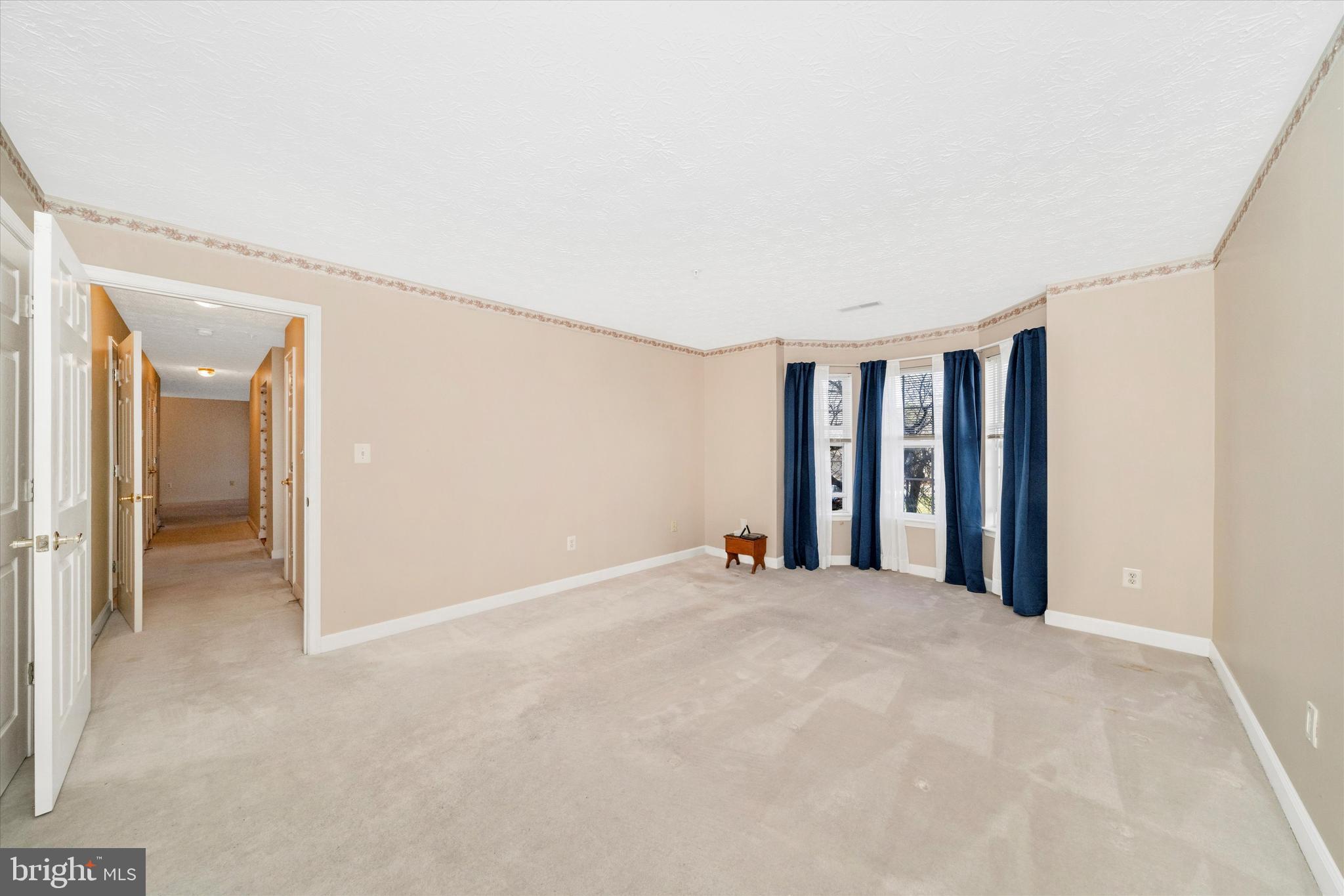 6117 Springwater Place, Unit 1723 Frederick, MD 21701 - Photo 29 of 50 a view of an empty room with closet and a window
