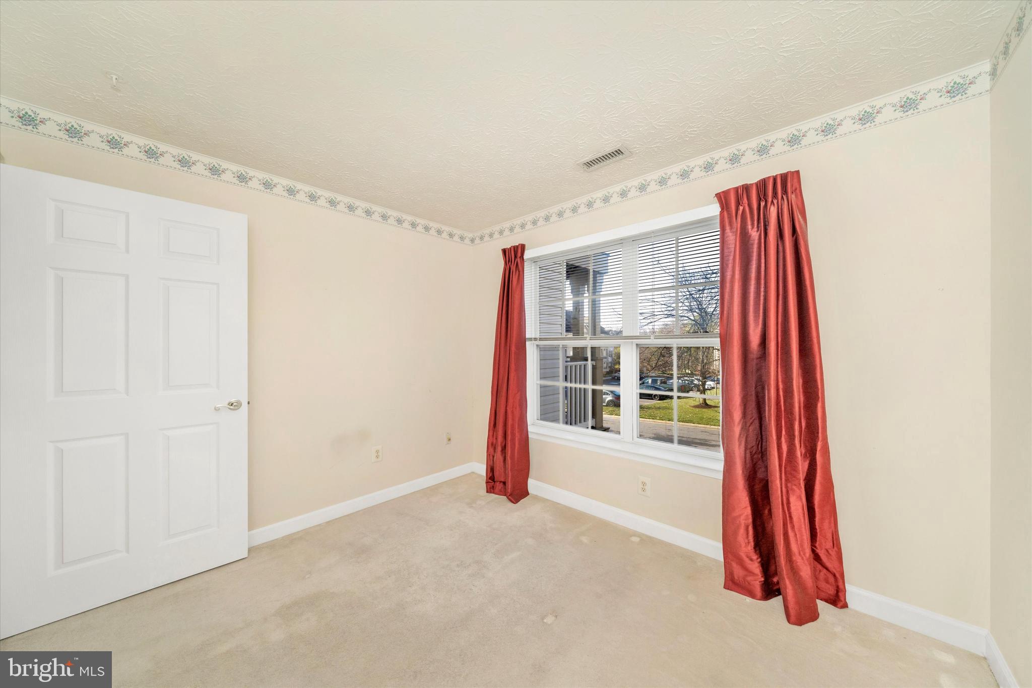 6117 Springwater Place, Unit 1723 Frederick, MD 21701 - Photo 35 of 50 a view of a room with wooden floor and entryway