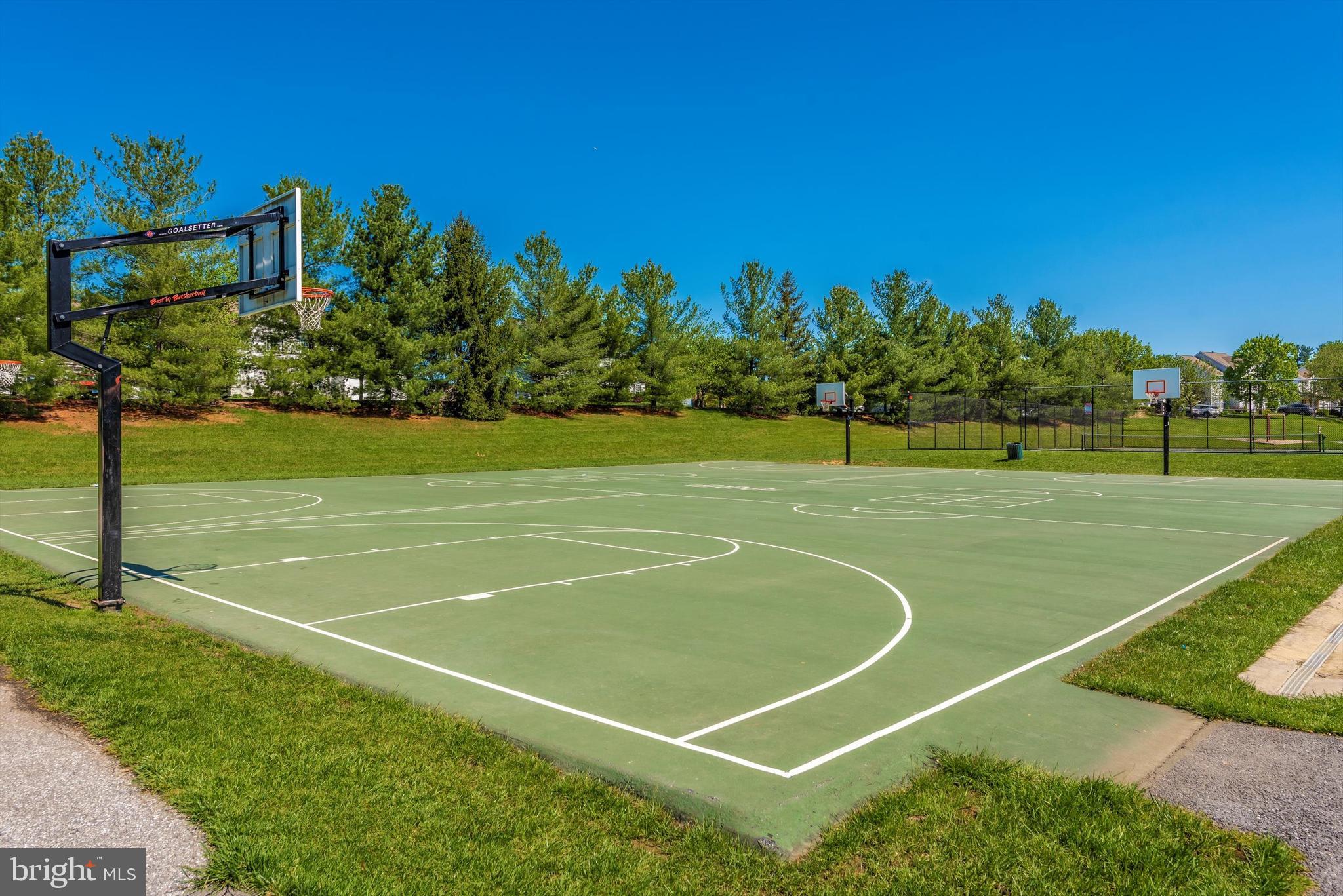 6117 Springwater Place, Unit 1723 Frederick, MD 21701 - Photo 44 of 50 a view of a tennis court