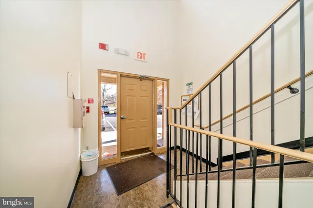 a view of an entryway with wooden floor