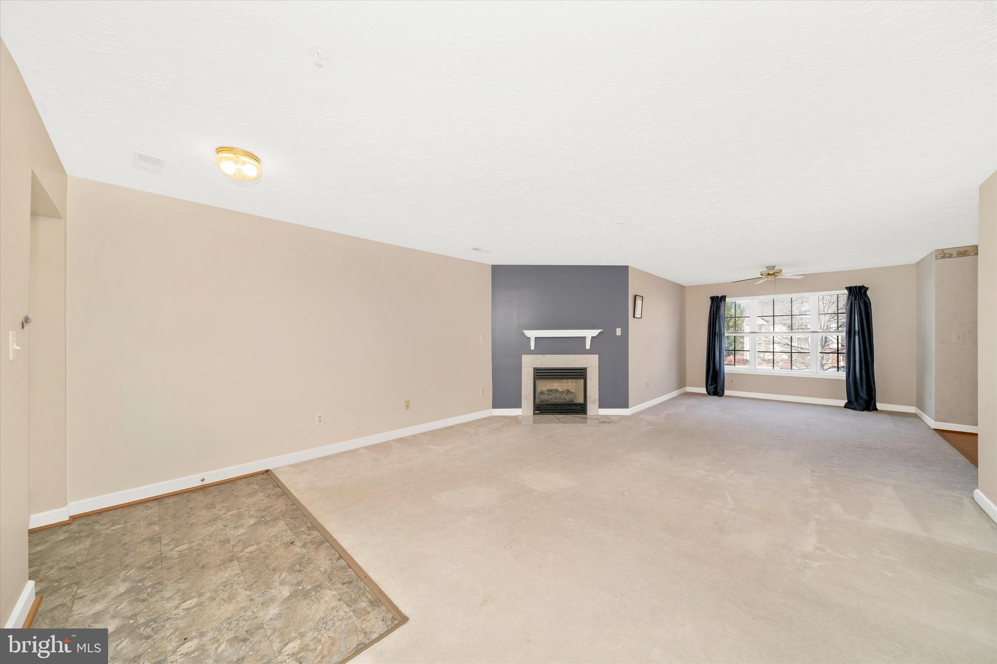 6117 Springwater Place, Unit 1723 Frederick, MD 21701 - Photo 10 of 50 a view of an empty room with a window