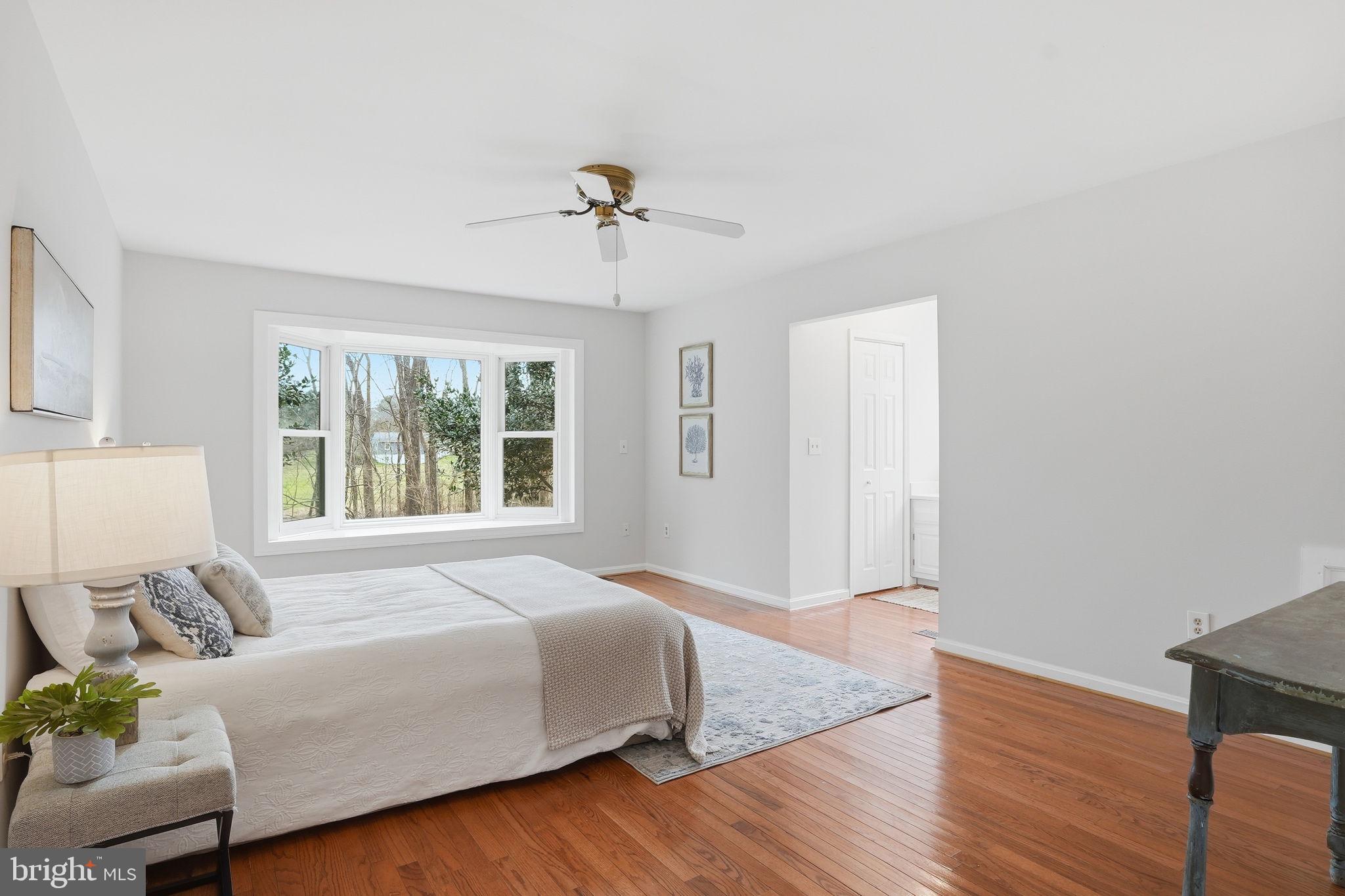18311 Queen Anne Bridge Road Bowie, MD 20716 - Photo 25 of 46 a spacious bedroom with a bed and window
