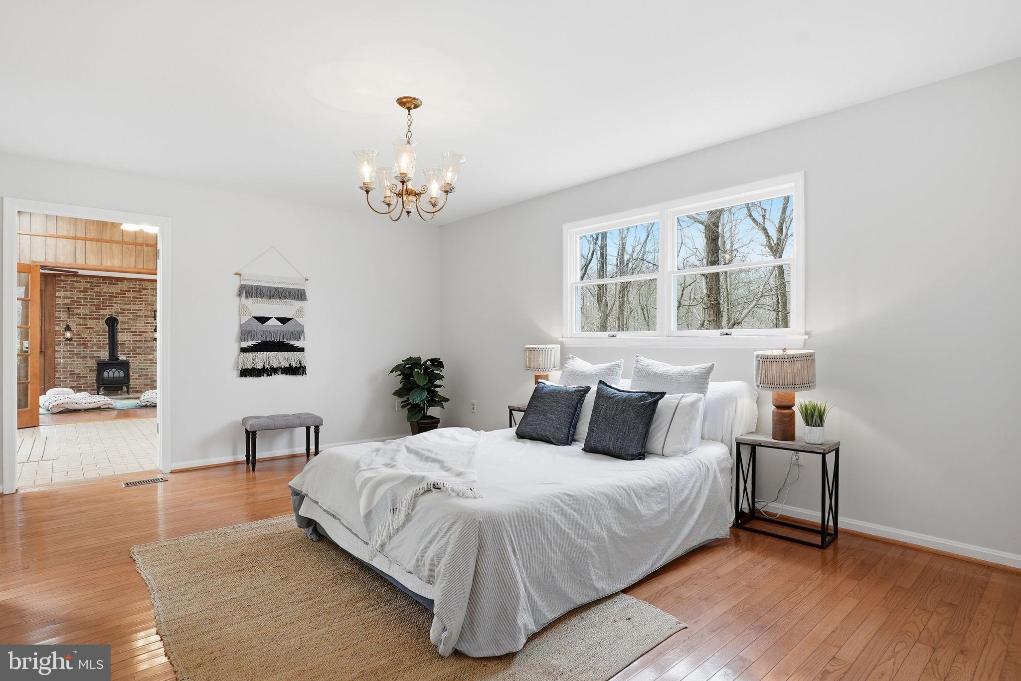 18311 Queen Anne Bridge Road Bowie, MD 20716 - Photo 29 of 46 a bedroom with a large bed and a window