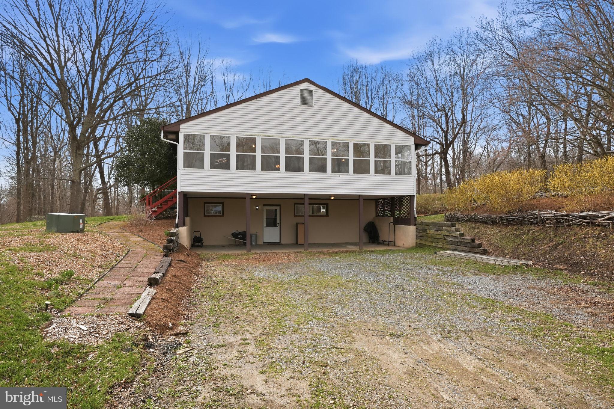 18311 Queen Anne Bridge Road Bowie, MD 20716 - Photo 36 of 46 a front view of a house with a yard