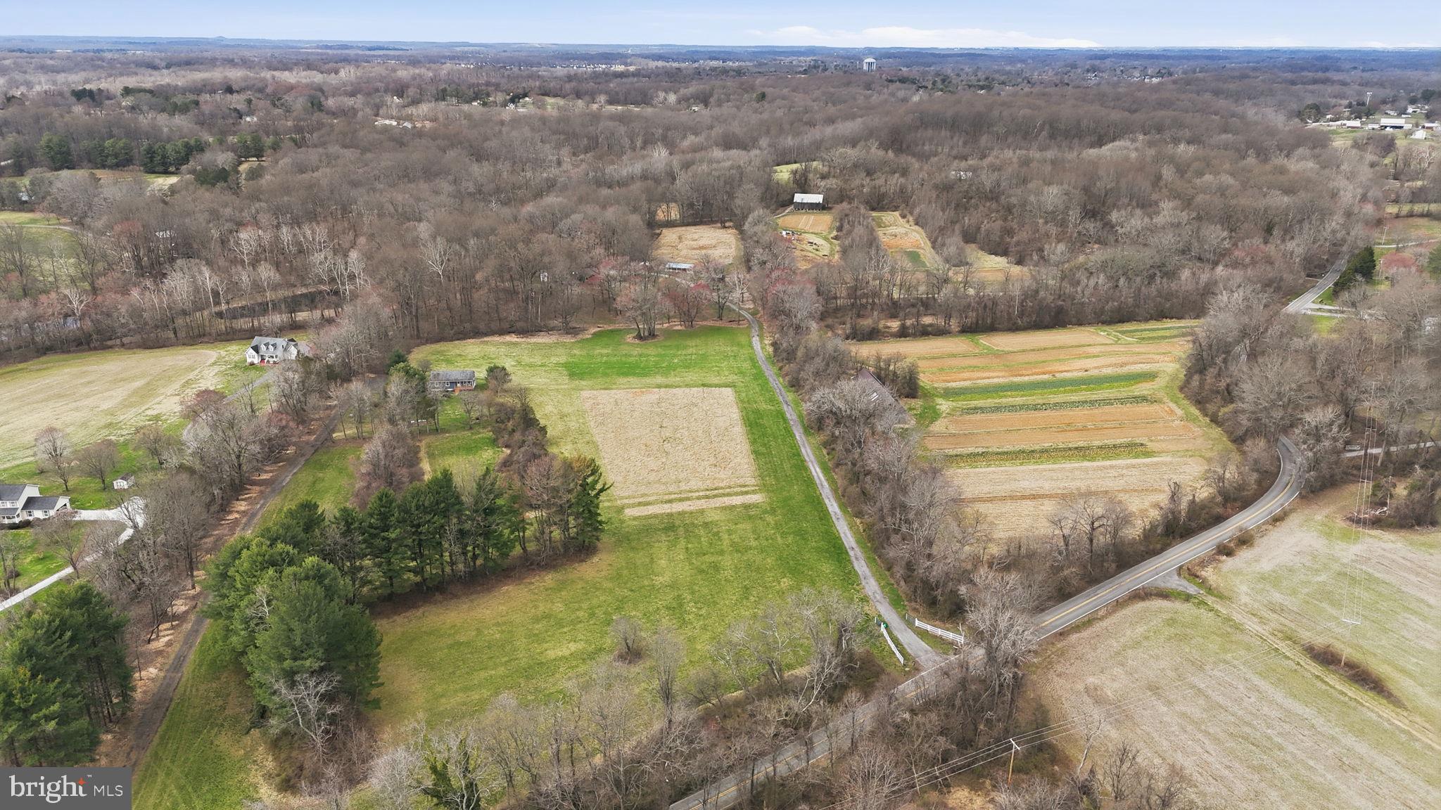 18311 Queen Anne Bridge Road Bowie, MD 20716 - Photo 5 of 46 an aerial view of a house with a yard