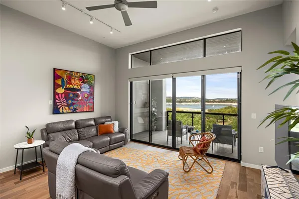 a bedroom with furniture and a large window