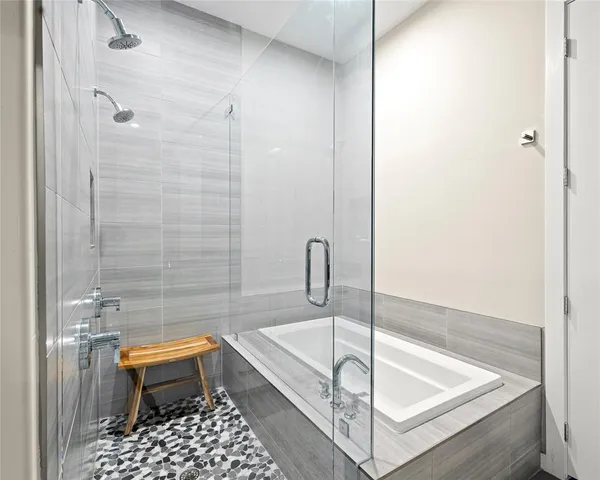 a bathroom with a tub and a sink