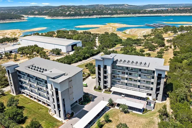 an aerial view of a house with a ocean view