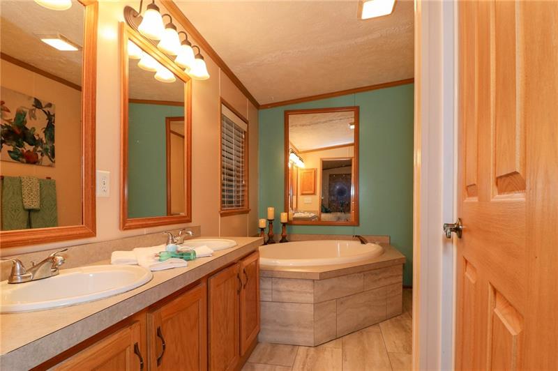 120 Goldscheitter Road Sarver, PA 16055 - Photo 10 of 20 THE MASTER BATH SUITE FEATURES A DOUBLE BOWL VANITY, SOAKING TUB, SEPARATE SHOWER AND LINEN CLOSET.