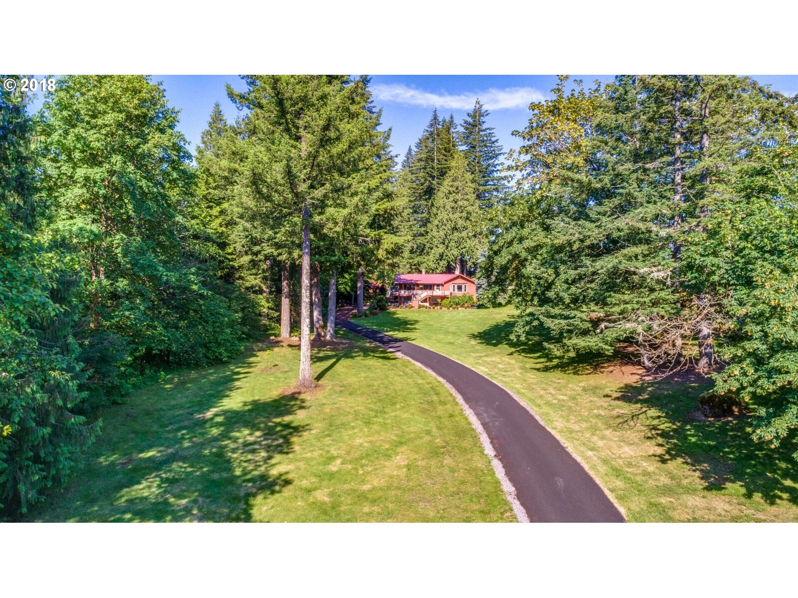 19971 Southeast Baty Road Sandy, OR 97055 - Photo 4 of 32 a outdoor space with swimming pool and trees in the background