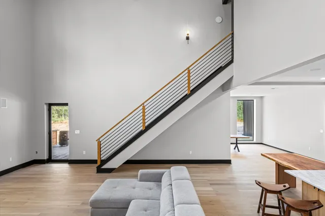 a large kitchen with a table and chairs