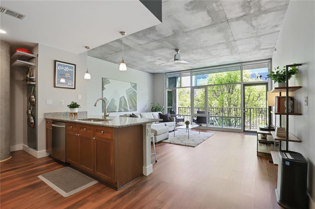 a view of living room with granite countertop furniture and a large window