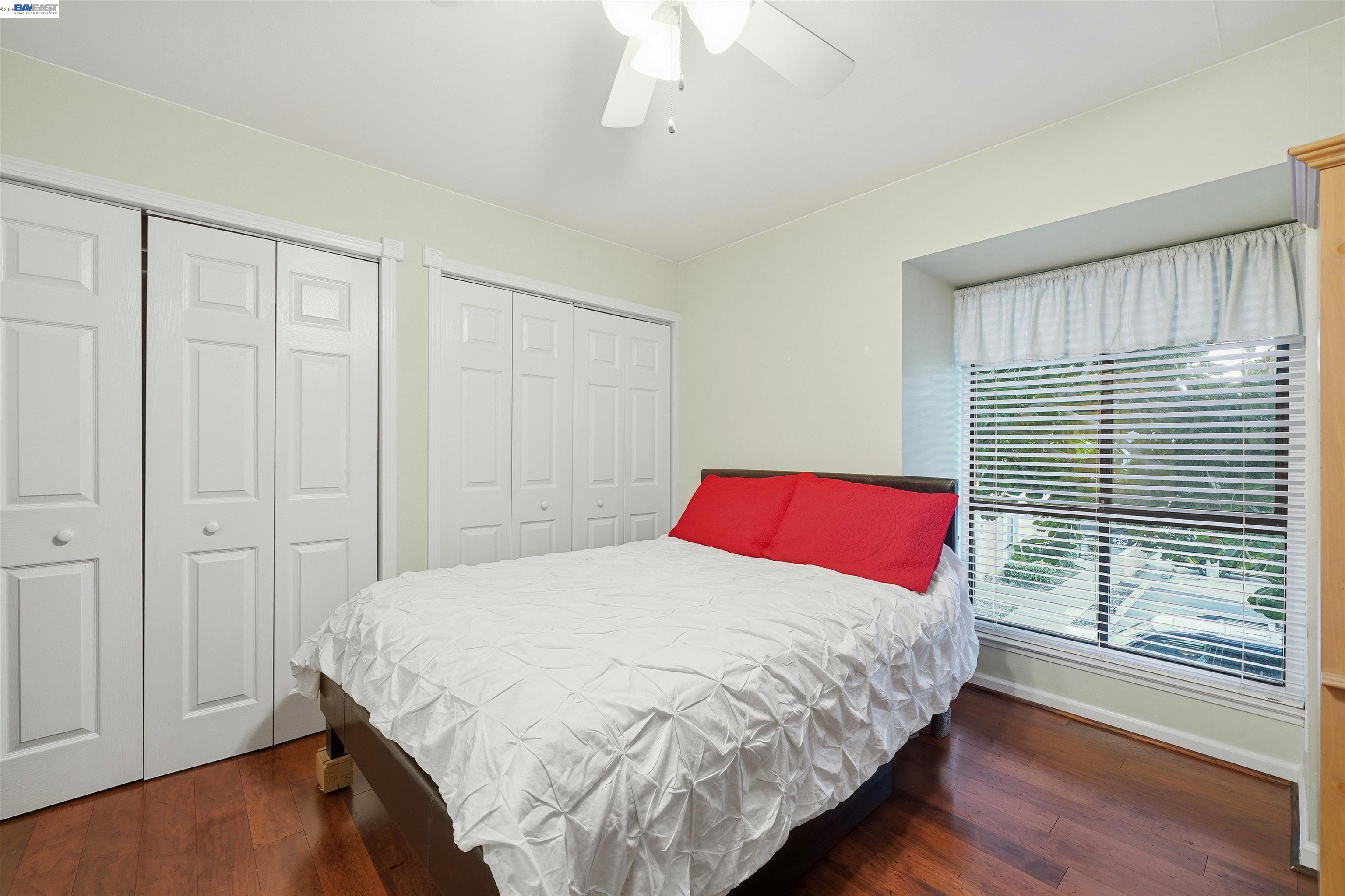 8985 Alcosta Boulevard, Unit 162 San Ramon, CA 94583 - Photo 28 of 33 a bedroom with a bed and a window