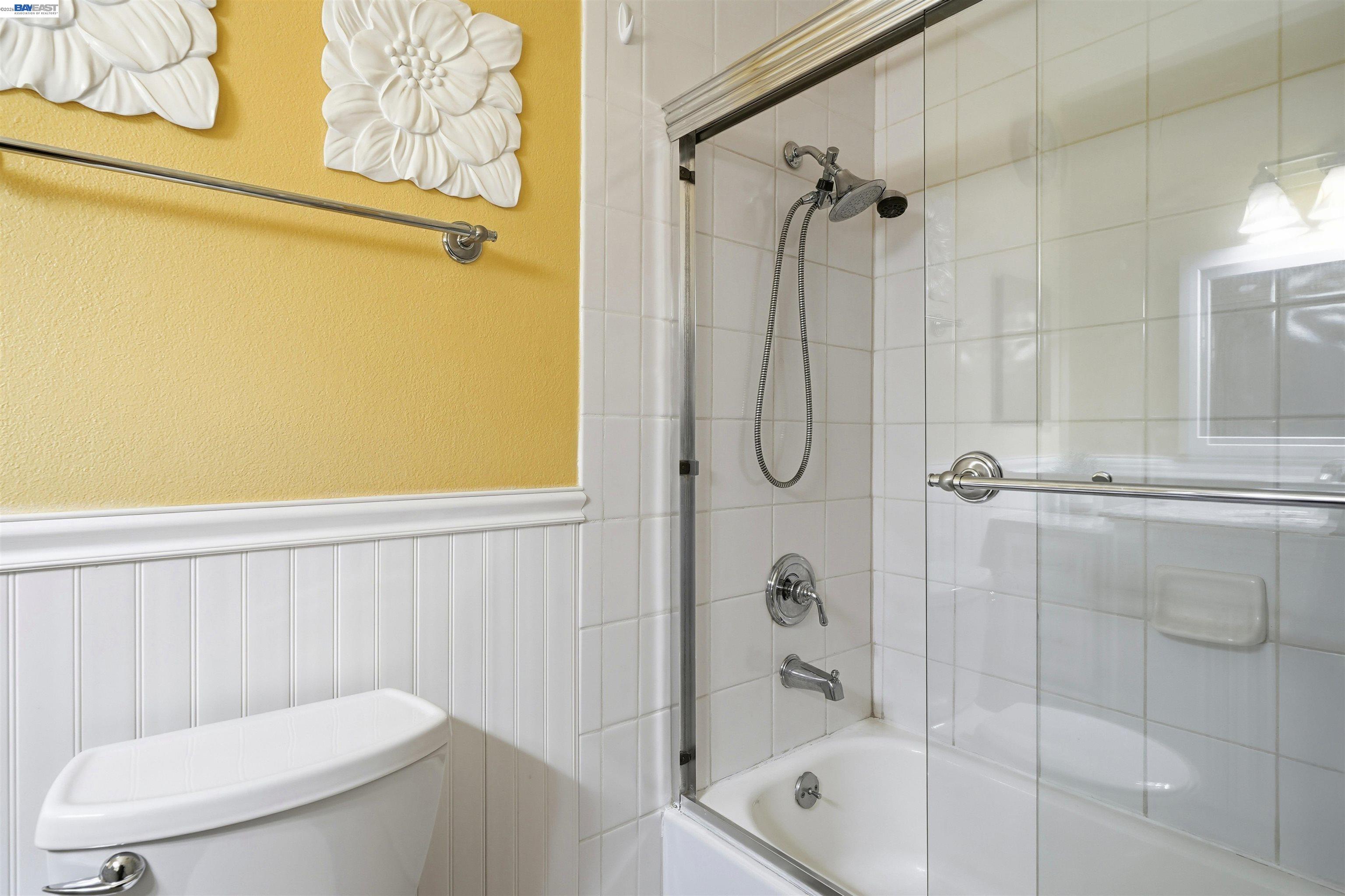 8985 Alcosta Boulevard, Unit 162 San Ramon, CA 94583 - Photo 31 of 33 a bathroom with a toilet a sink and shower