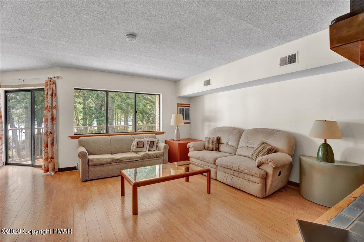 7 Midlake Drive, Unit 201A Lake Harmony, PA 18624 - Photo 19 of 34 a living room with furniture and a large window