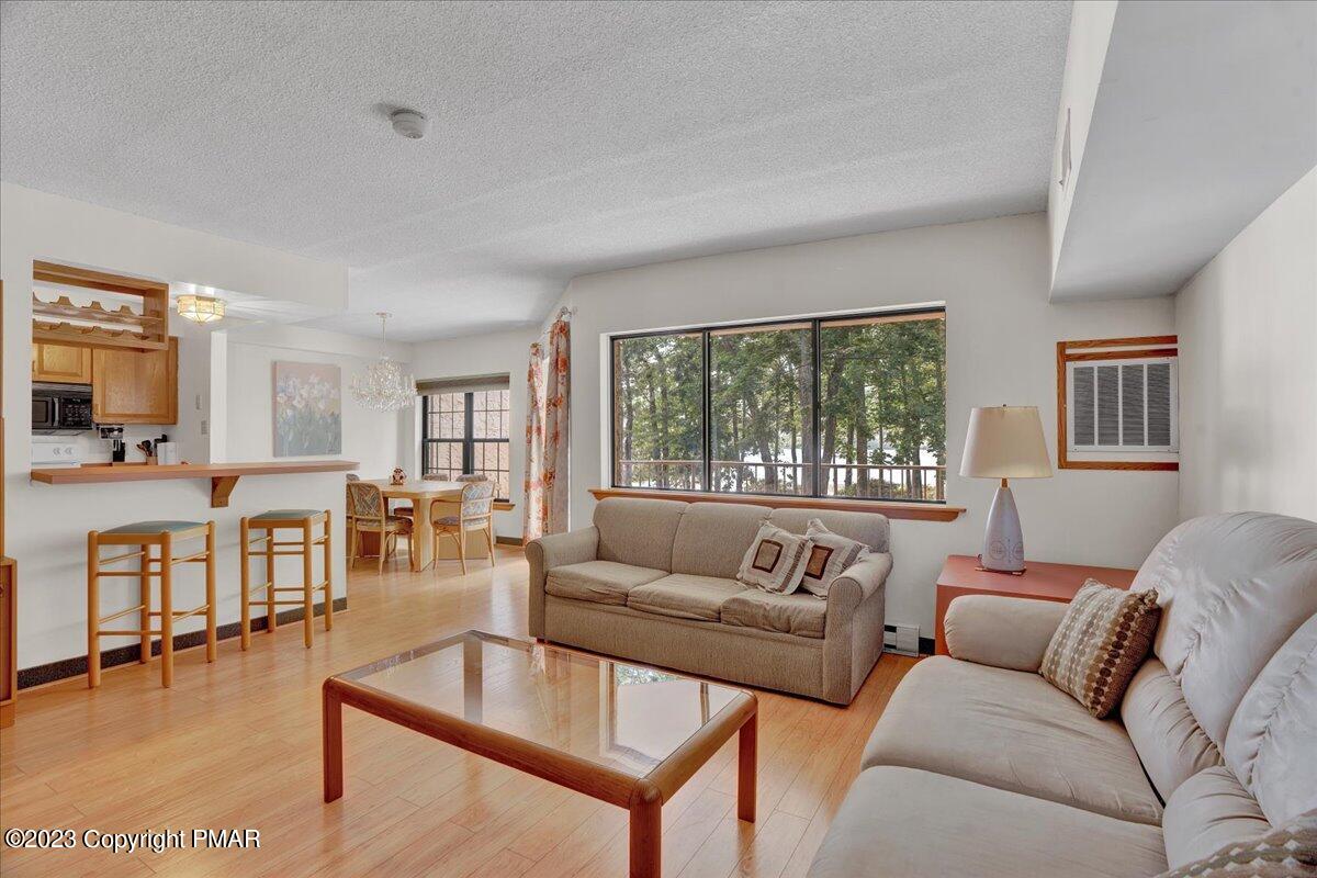7 Midlake Drive, Unit 201A Lake Harmony, PA 18624 - Photo 20 of 34 a living room with furniture and a large window