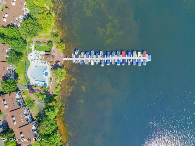 a bedroom with two beds and a large window