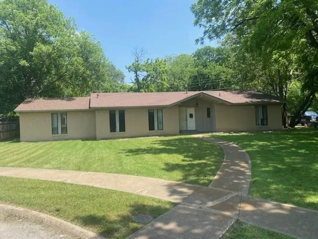 a large kitchen with kitchen island a sink dishwasher a stove and a refrigerator with wooden floor