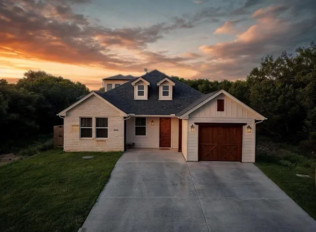 a front view of a house with yard