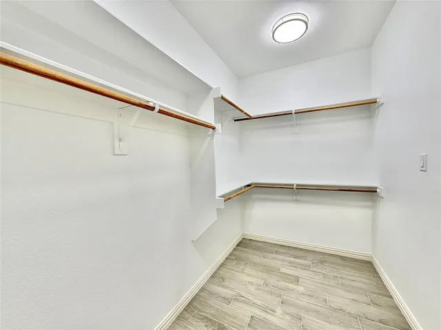 a view of an empty walk in closet