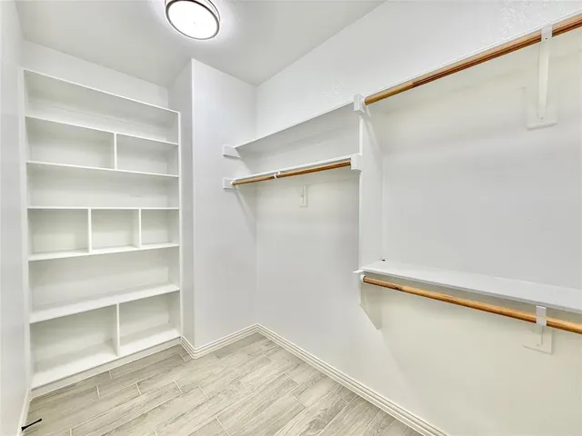 a view of an empty walk in closet