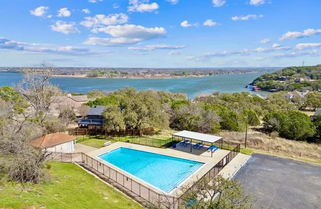 a view of a swimming pool with an ocean view