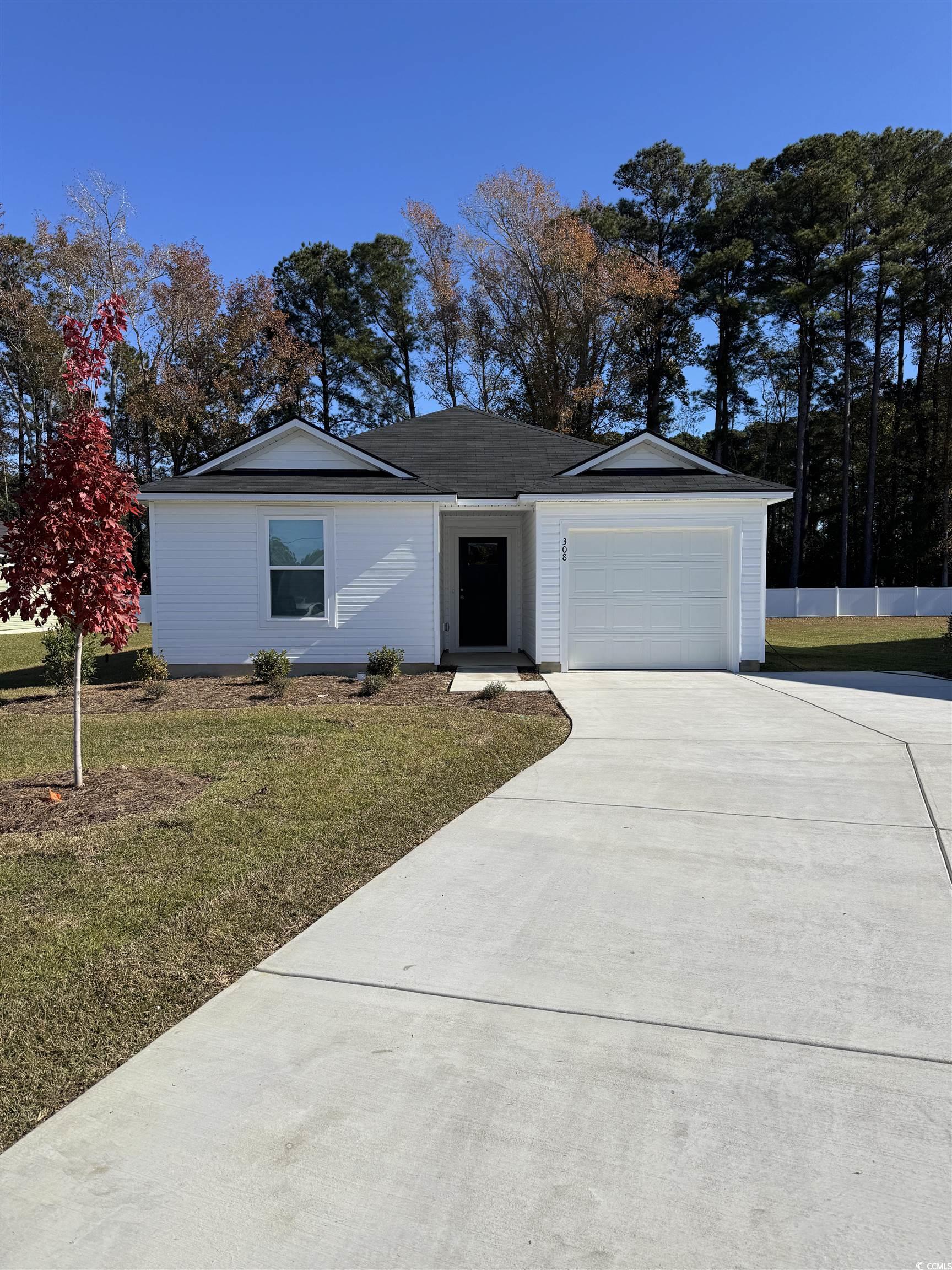308 Mistletoe Way Longs, SC 29568 - Photo 1 of 19 Ranch-style house featuring concrete driveway and an attached garage