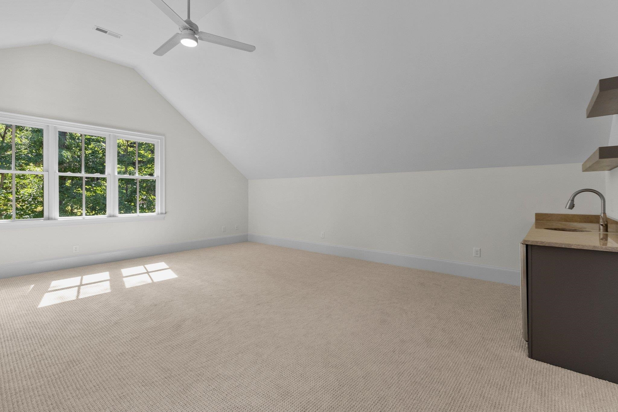 1500 Banbury Road Raleigh, NC 27607 - Photo 25 of 39 Extra large Bonus Room. Features a wet bar with cooler, sink and shelving. Bonus Room