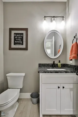 a bed room with a bed and a ceiling fan