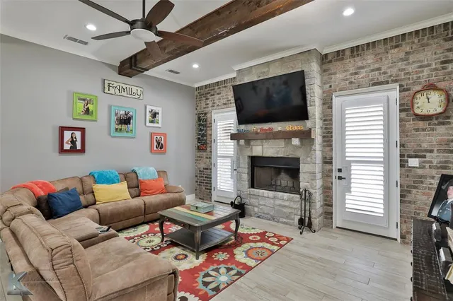 a living room with furniture or flat screen tv and a fireplace
