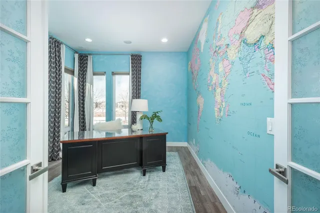 a bathroom with a bathtub sink and mirror