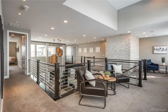 a view of a hallway with furniture