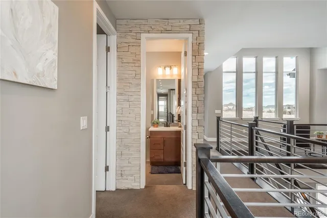 a view of a room that has a bed and a table in it