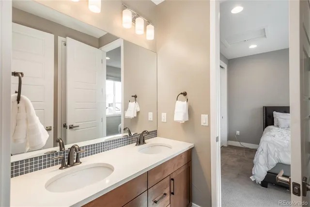 a bathroom with a sink double vanity and a mirror